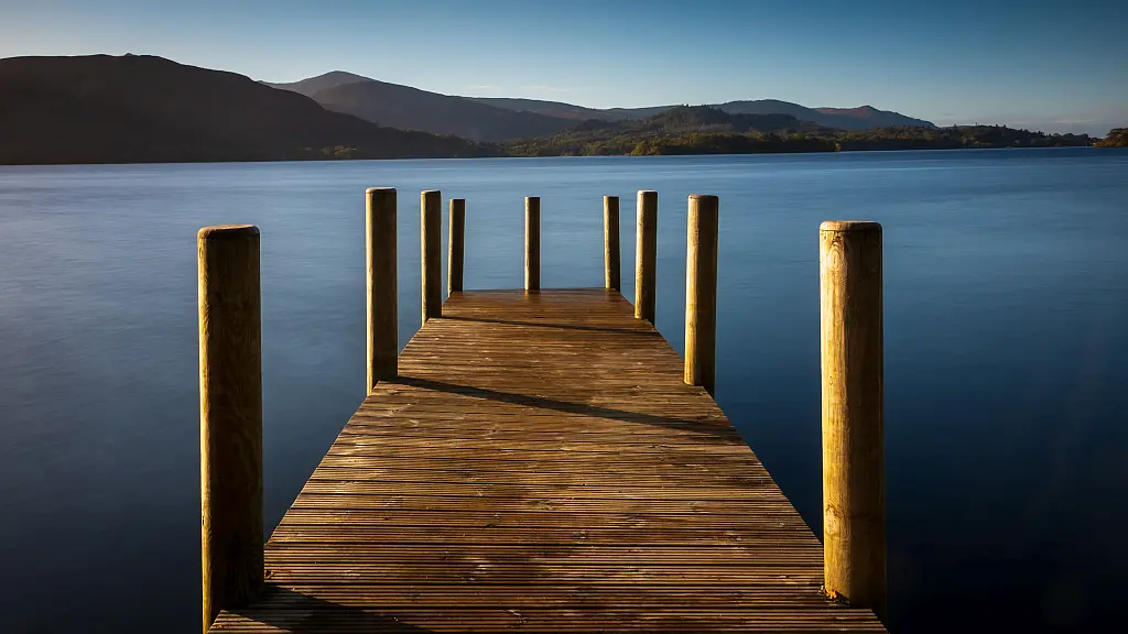 Pier at sunset at Windermere lake in the Lake District