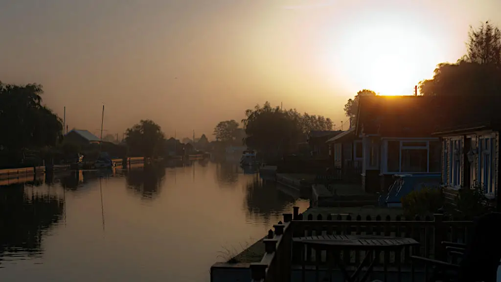 Twilight and sunshine on a river bank in Norfolk